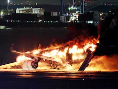 Pics: Plane In Flames At Tokyo Airport After Colliding With Another Aircraft