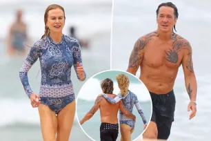 Loved-up Keith Urban and Nicole Kidman hit the beach in Sydney with daughter Faith