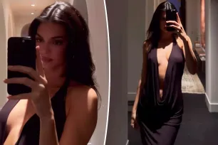 Kendall Jenner heats things up in dangerously plunging black dress