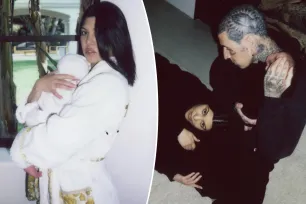 Kourtney Kardashian cradles son Rocky in luxe Versace robe