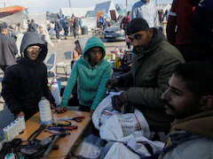 Gaza Cobblers Work By Roadsides To Mend Shoes Of Displaced