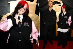 Billie Eilish reps ‘Barbie’ in pink varsity jacket on the Grammys 2024 red carpet