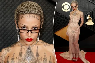 Doja Cat flaunts fully tattooed body in dress made to look like a wardrobe malfunction at Grammys 2024