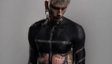 Machine Gun Kelly reveals shocking blacked out tattoo covering his chest