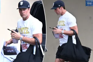 Tom Brady flaunts his bulging biceps in Popeye T-shirt at the gym