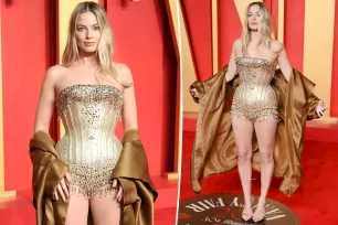 Margot Robbie shows a lot of leg in Mugler bodysuit at 2024 Vanity Fair Oscars party