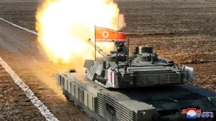 North Korea’s Kim Jong Un ‘drives’ new tank during mock battle