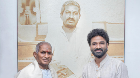 Ilaiyaraaja visits Devi Sri Prasad’s studio and poses before his life-sized picture. See here