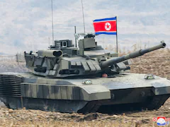 Kim Jong Un In Leather Jacket "Drives" North Korea's New Tank In Mock Battle