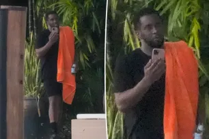 Sean ‘Diddy’ Combs takes phone call with beer in hand outside his Miami home after son sued for sexual assault