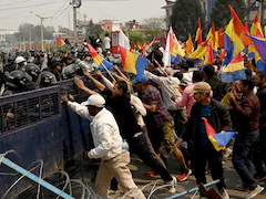 Nepal Police Fire Tear Gas, Clash With Pro-Monarchy Protesters