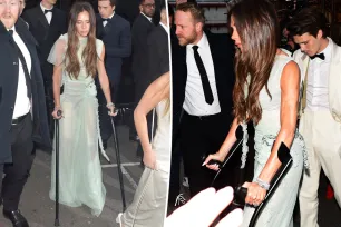 Victoria Beckham arrives at her star-studded 50th birthday party in glamorous gown and crutches