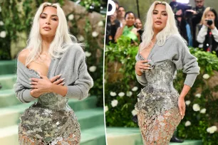 Kim Kardashian explains why she held ‘raggedy, pilled sweater’ over shocking corset dress at 2024 Met Gala