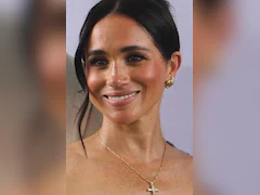 Meghan Markle Wears Princess Diana's Diamond Cross Necklace In Nigeria