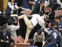 Video: Taiwan MP Tries To Run Away With Bill To Stop It From Being Passed