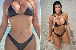 Kim Kardashian shows off curves in bikini and body chains: ‘Built like a trophy’