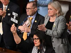 US Lawmaker Hold Ups "War Criminal" Sign During Netanyahu's Congress Speech