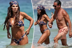 Tanned Teresa Giudice and husband Luis Ruelas frolic through the waves while on Ibiza vacation