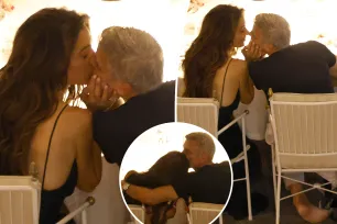 Barefoot George Clooney and wife Amal share a passionate kiss during dinner in Italy