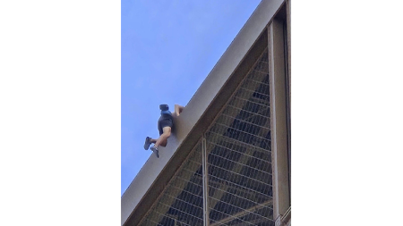 Eiffel Tower evacuated hours before Olympics closing ceremony as shirtless man seen climbing iconic structure