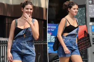 Suri Cruise, 18, cools off with crop top and overalls on summer stroll in NYC