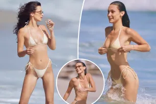 Bella Hadid takes a dip in a tiny nude bikini during Malibu beach day