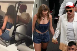 Taylor Swift cuddles up to Travis Kelce as they dash out of stadium following Chiefs win